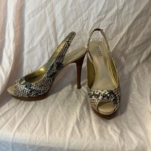 Gently used heels by Marciano snakeskin with platform
